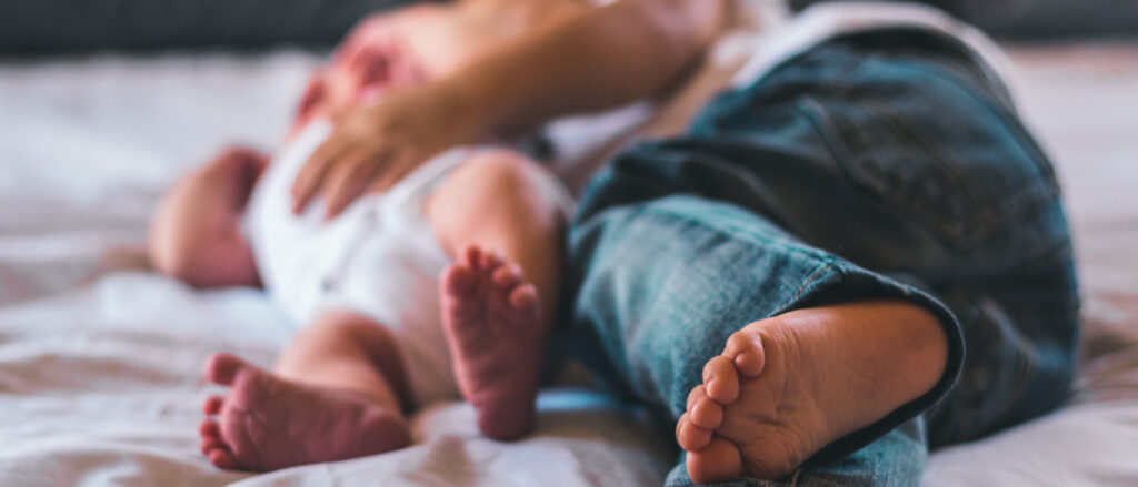 baby feet and parent's feet